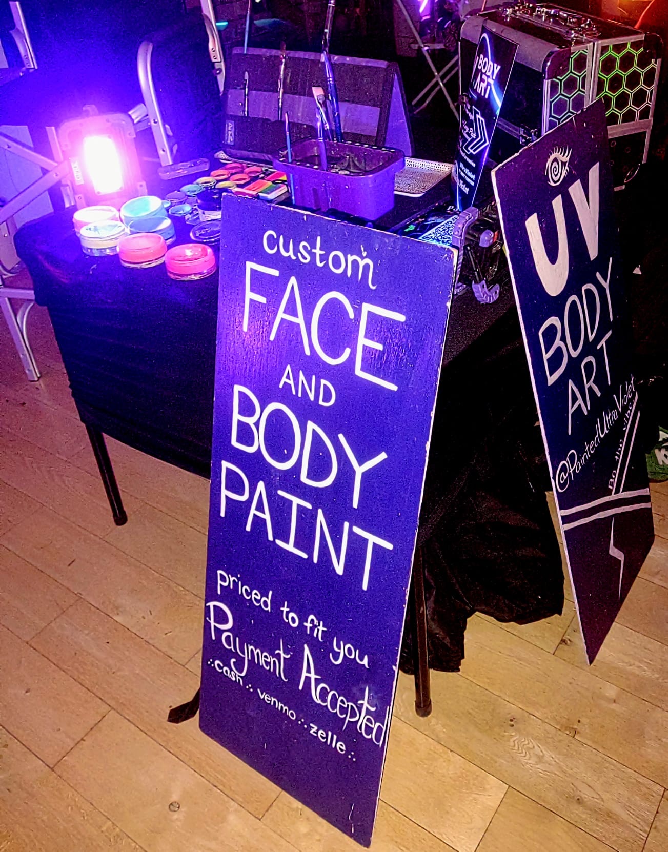 A body art vendor's hand-painted signage at a Sanctuary event A body art vendor's hand-painted signage at a Sanctuary event